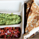 aerial view of quesadilla tray with cups for salsa, guacamole, and sour cream